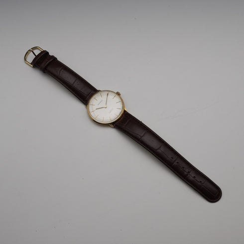 Reloj de pulsera para caballero, Garrard británico de alrededor de 1980, caja chapada en oro, mecánico de 17 rubíes, en buen estado de funcionamiento.