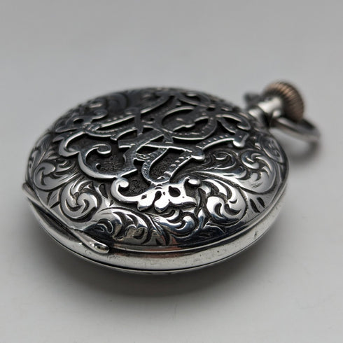 Circa 1900 Antique Swiss made small pocket watch Engraved silver side case Good working condition