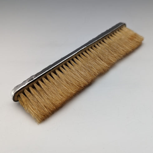 Antique American sterling silver brush with embossed handle