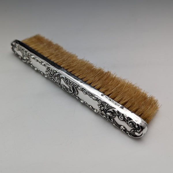 Antique American sterling silver brush with embossed handle
