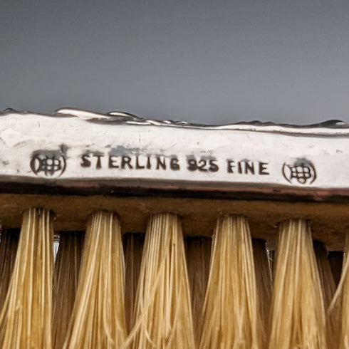 Antique American sterling silver brush with embossed handle