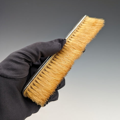 Antique American sterling silver brush with embossed handle