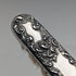 Antique American sterling silver brush with embossed handle