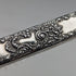 Antique American sterling silver brush with embossed handle