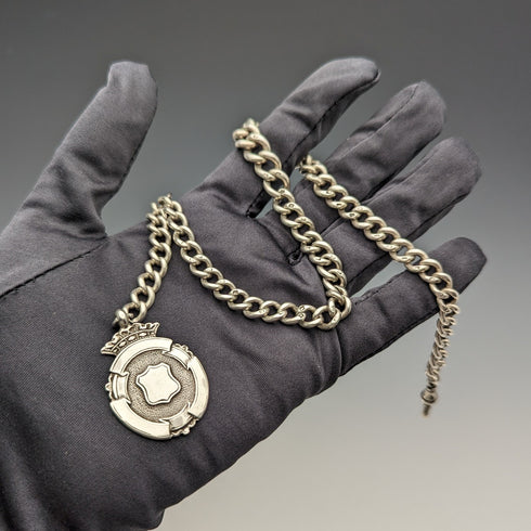 Circa 1900 British antique sterling silver Albert chain, 52g, sterling silver medal fob