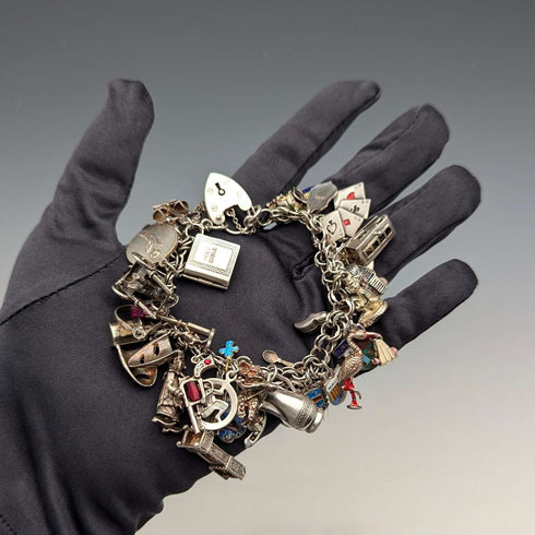 1970s British vintage sterling silver charm bracelet, 89g