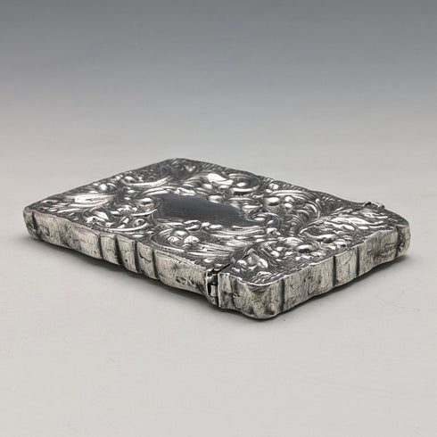 Antique American sterling silver card case with embossed decoration, 75g