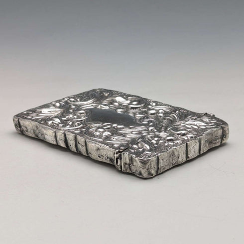 Antique American sterling silver card case with embossed decoration, 75g
