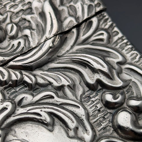 Antique American sterling silver card case with embossed decoration, 75g