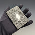 Antique American sterling silver card case with embossed decoration, 75g