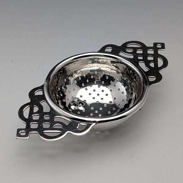 Vintage British silver plate tea strainer