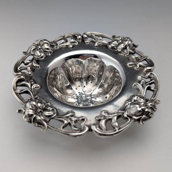 Antique American sterling silver tea strainer with floral decoration