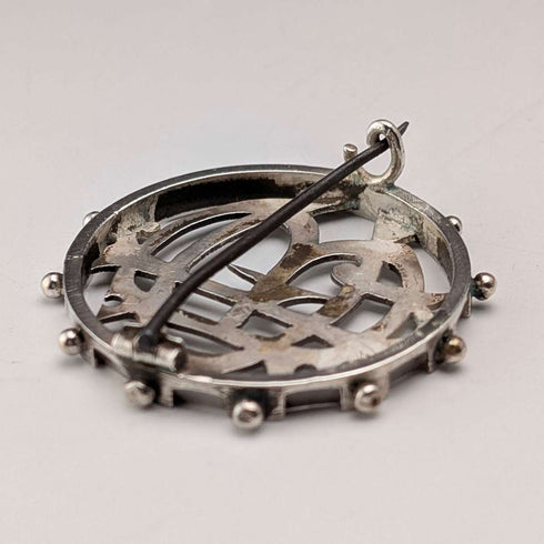 Antique sterling silver monogrammed round brooch