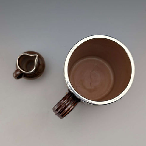 Circa 1900 British antique sterling silver decorated ceramic mug and mini cream jug Mappin & Webb