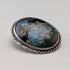 Vintage British sterling silver oval brooch featuring two women with butterfly wings