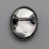 Vintage British sterling silver oval brooch featuring two women with butterfly wings