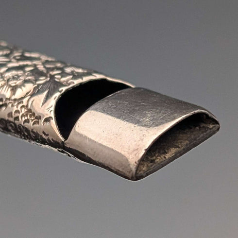 1902 British antique floral decorated sterling silver whistle by William Manton, with chain