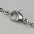 1902 British antique floral decorated sterling silver whistle by William Manton, with chain