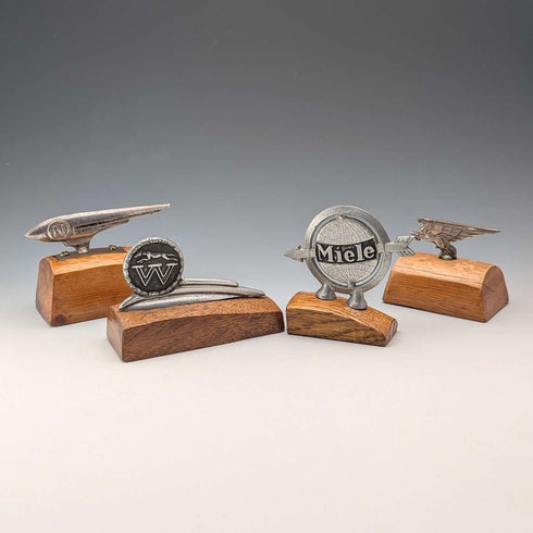 4 vintage Fender mascots with wooden stands