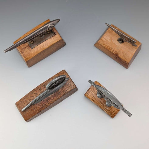 4 vintage Fender mascots with wooden stands
