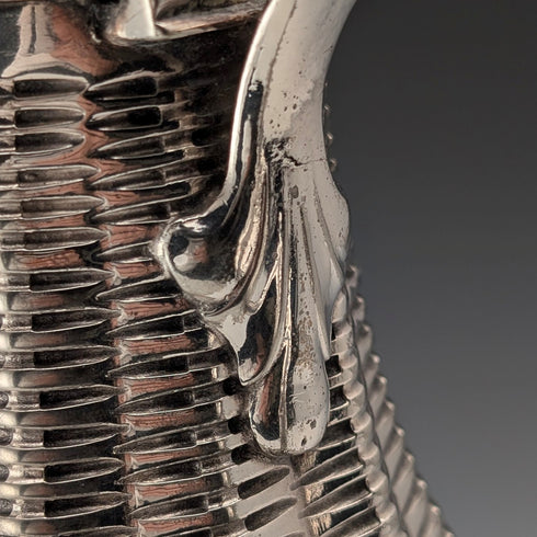 Antique British silver plate water jug decorated with woven rattan pattern