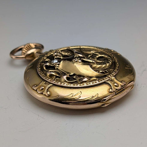 Zenith pocket watch, circa 1913, with dragon relief carving, 18k gold hunter case, in good working order.