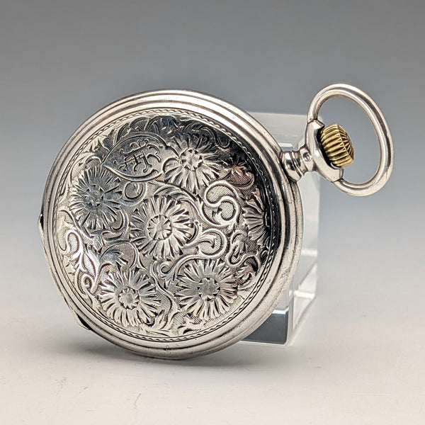 Antique Longines pocket watch, circa 1912, floral decoration, silver-sided hunter case, in good working order.