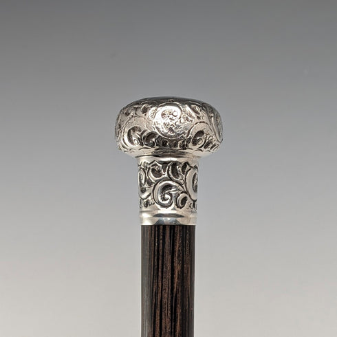 Antique British black shaft engraved sterling silver walking stick with rondelle handle, 86cm