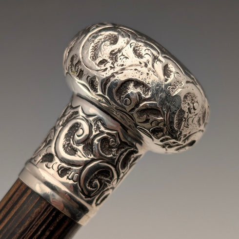 Antique British black shaft engraved sterling silver walking stick with rondelle handle, 86cm