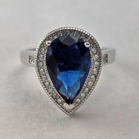 Vintage sterling silver drop-shaped blue cubic zirconia ring (size 12)