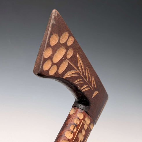 Vintage brown shaft walking stick with carved wood accents and an axe-shaped handle, 85cm