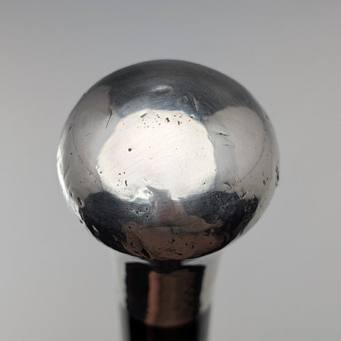 British antique black shaft sterling silver plain rondelle handle walking stick, 87cm