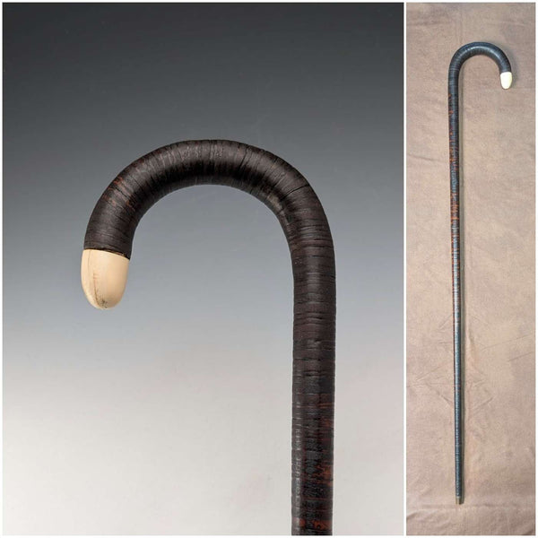 Antique British bone decorated curved handle leather wrapped iron shaft walking stick 89cm