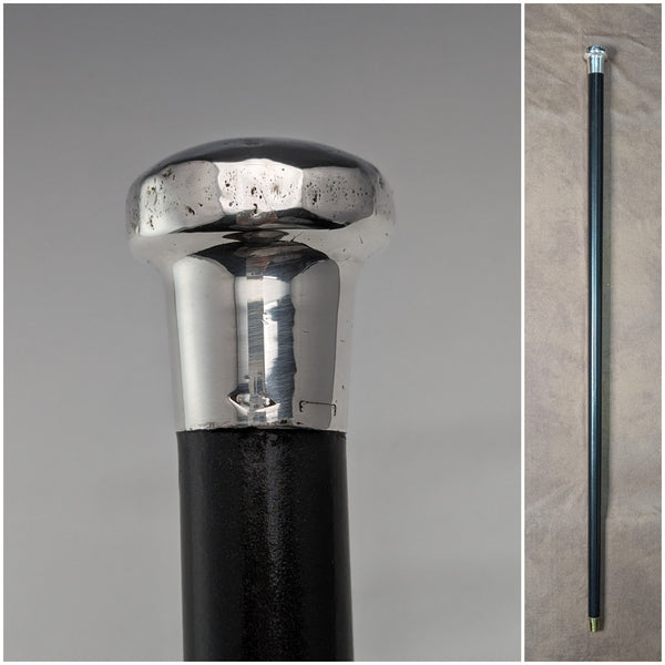 Circa 1925 British vintage gentleman's walking stick, made of sterling silver, round handle, black shaft, 86cm