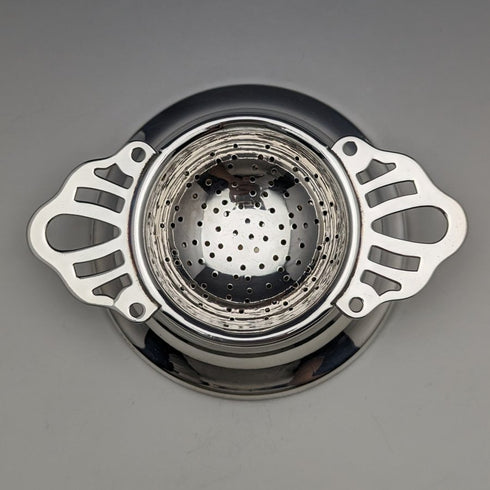 British vintage silver plate tea strainer
